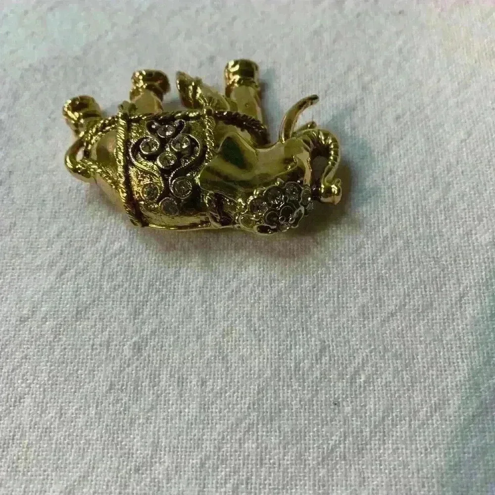 Vintage elephant, brooch, gold with bezel set rhinestones